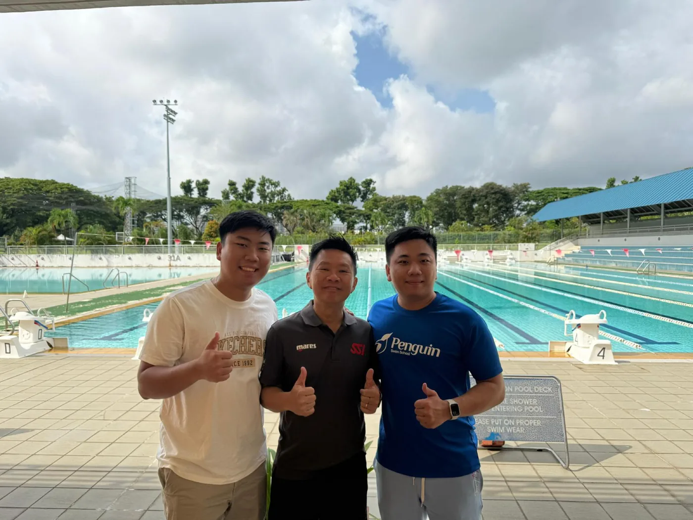 Rayner Teo with Ricky from SSI and Remus, SSI trainer instructor, at a Singapore swimming pool