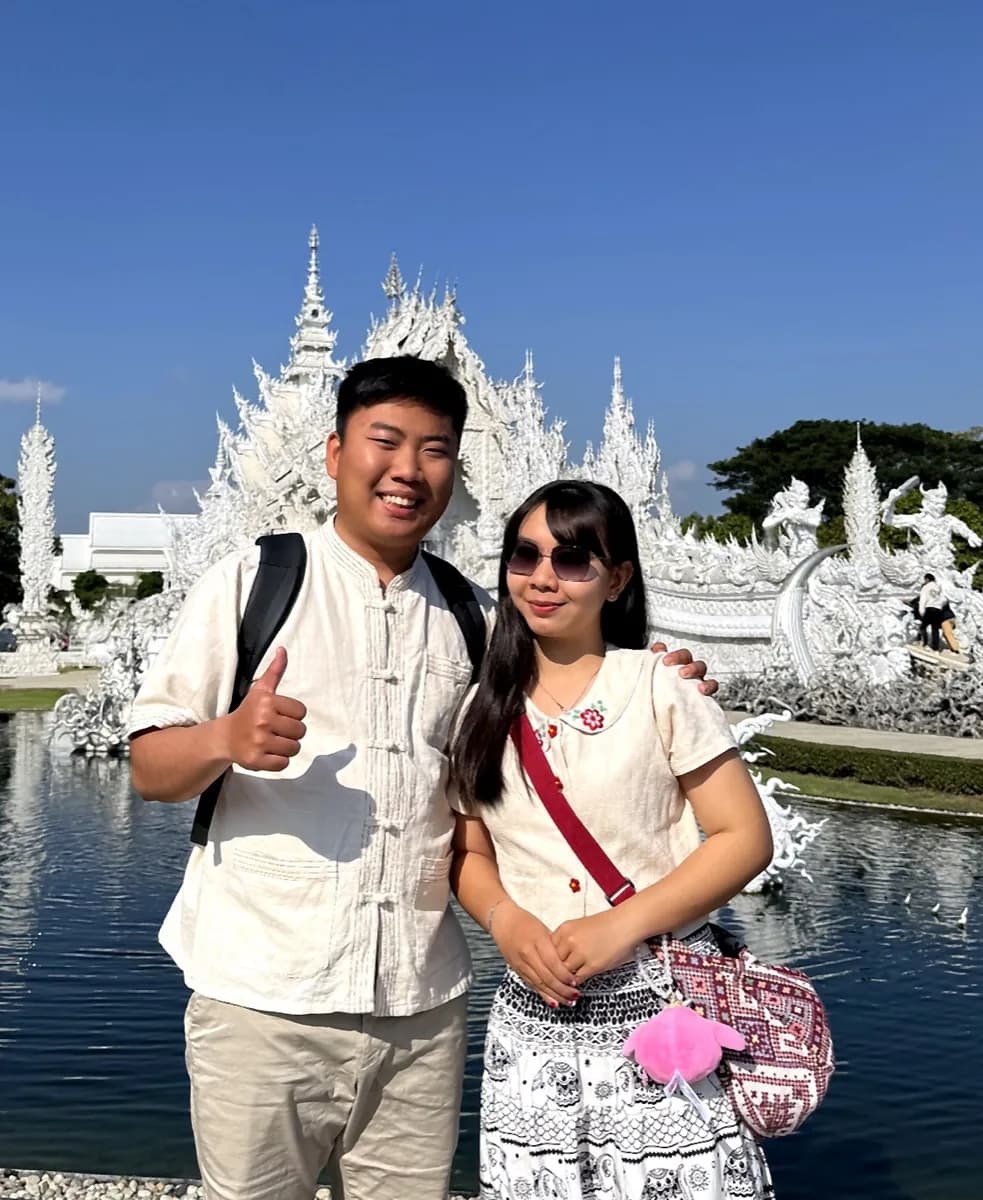 Rayner and Panita creating Thailand travel and culture content at the White Temple